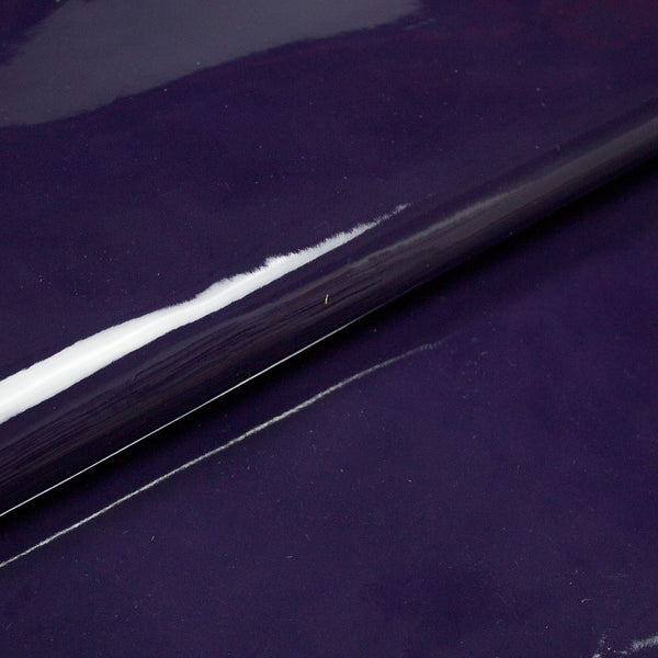 PIECE OF PURPLE PATENT LEATHER 