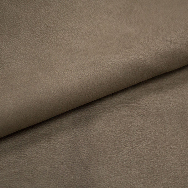 A piece of leather against blue