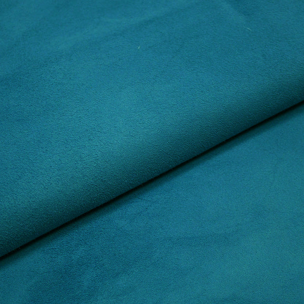 A piece of leather against blue