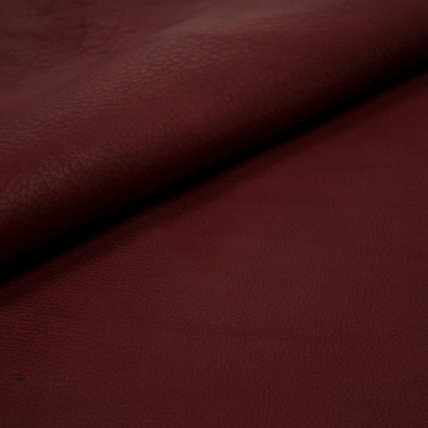 PIECE OF BURGUNDY PUMPED COW LEATHER 