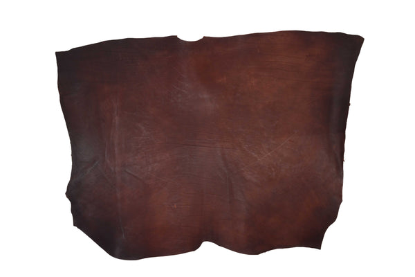 OLDED MAHOGUE PIECE OF LEATHER